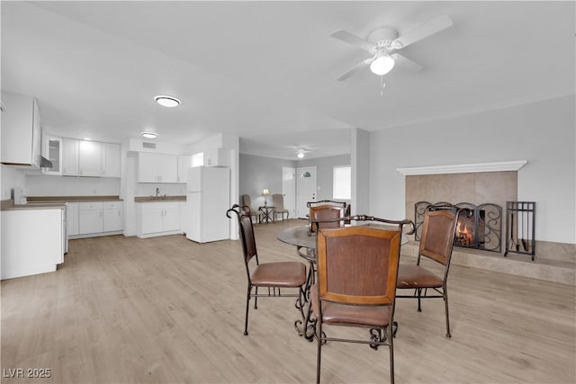 721 Carpenter Dr, Las Vegas, NV 89107 - dining room featuring ceiling fan and light wood finished floors