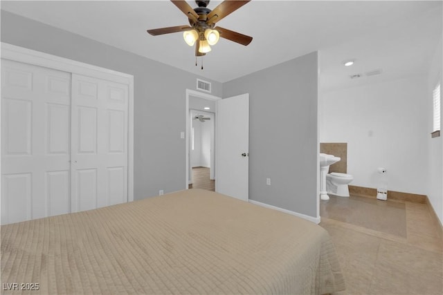 721 Carpenter Dr, Las Vegas, NV 89107 - unfurnished bedroom with a closet, baseboards, ensuite bathroom, tile patterned flooring, and ceiling fan