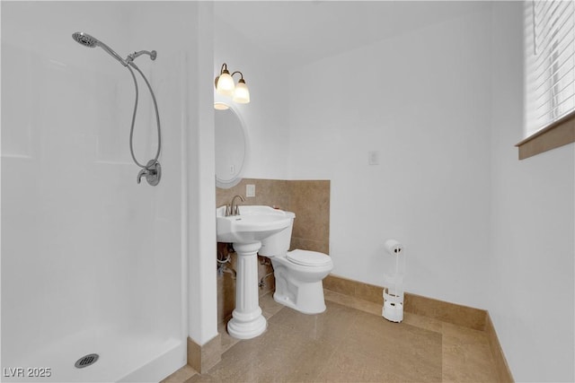 721 Carpenter Dr, Las Vegas, NV 89107 - full bath featuring a shower stall, toilet, and tile walls