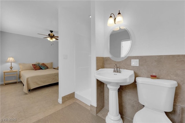 721 Carpenter Dr, Las Vegas, NV 89107 - bathroom featuring ceiling fan and toilet