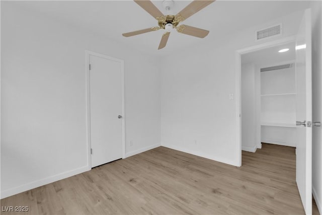 721 Carpenter Dr, Las Vegas, NV 89107 - empty room with light wood-style floors, ceiling fan, and baseboards