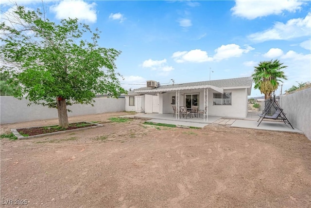 721 Carpenter Dr, Las Vegas, NV 89107 - back of property featuring a patio area, a fenced backyard, and stucco siding