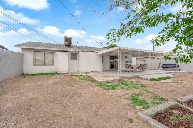 721 Carpenter Dr, Las Vegas, NV 89107 - rear view of house with fence, stucco siding, a patio, and a pergola