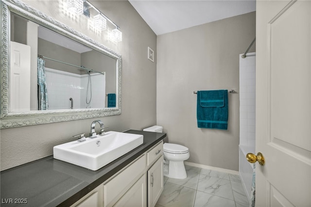 8501 W University Ave Unit 1083, Las Vegas, NV 89147 - full bath with marble finish floors, toilet, vanity, baseboards, and shower / bath combo with shower curtain