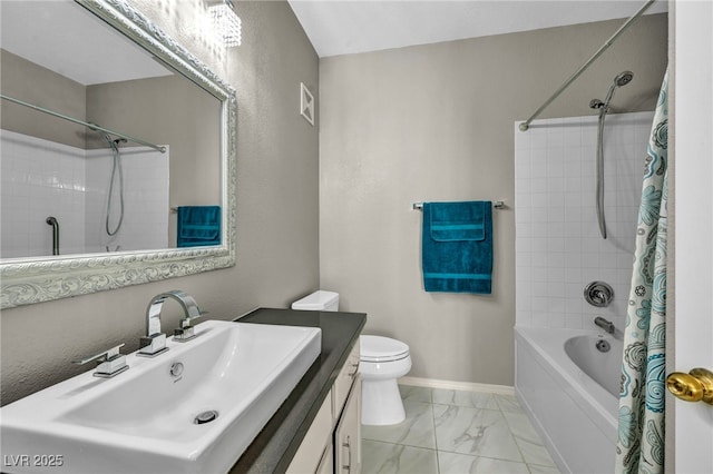 8501 W University Ave Unit 1083, Las Vegas, NV 89147 - full bathroom with marble look tile flooring, baseboards, shower / bath combo with shower curtain, vanity, and toilet