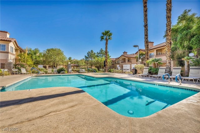 8501 W University Ave Unit 1083, Las Vegas, NV 89147 - community pool with a patio area and a residential view