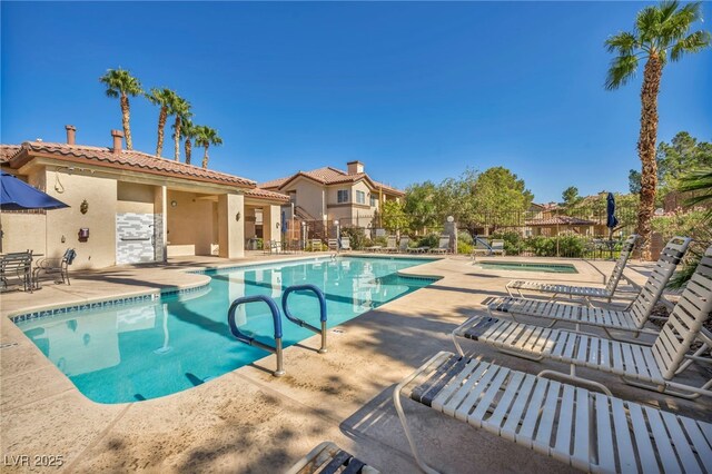 8501 W University Ave Unit 1083, Las Vegas, NV 89147 - community pool featuring a patio and a community hot tub