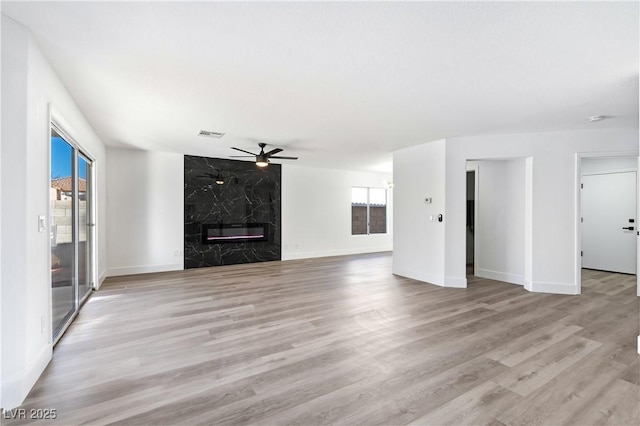 9541 Summersweet Ct, Las Vegas, NV 89123 - unfurnished living room featuring plenty of natural light, ceiling fan, wood finished floors, and baseboards