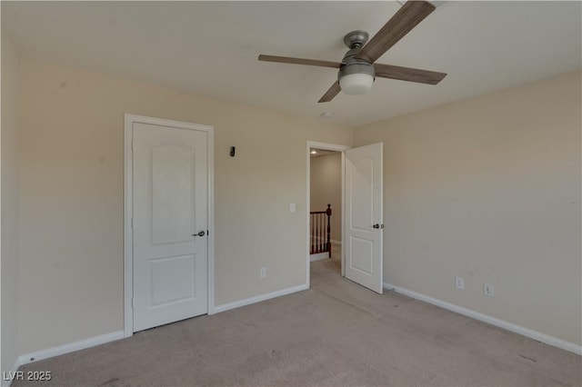 5912 Kit Cove Ct, Las Vegas, NV 89131 - unfurnished bedroom with light colored carpet, baseboards, and a ceiling fan