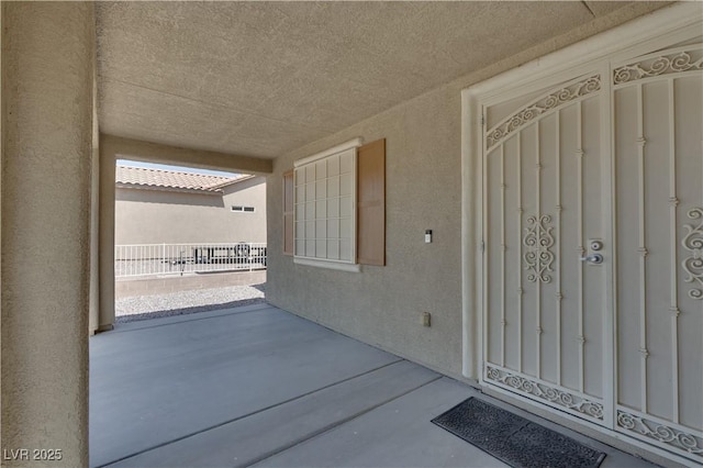 5912 Kit Cove Ct, Las Vegas, NV 89131 - entrance to property featuring stucco siding and a patio area
