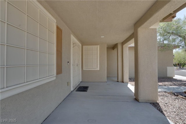 5912 Kit Cove Ct, Las Vegas, NV 89131 - doorway to property with stucco siding and a patio area