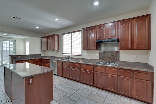 5912 Kit Cove Ct, Las Vegas, NV 89131 - kitchen featuring a peninsula, a sink, appliances with stainless steel finishes, recessed lighting, and under cabinet range hood