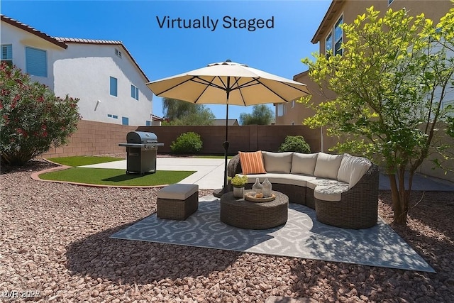 5912 Kit Cove Ct, Las Vegas, NV 89131 - fenced backyard with a grill, a patio, and an outdoor living space
