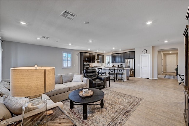 2902 Ventana Ridge Ave, Henderson, NV 89044 - living room with recessed lighting, baseboards, and light wood-style floors