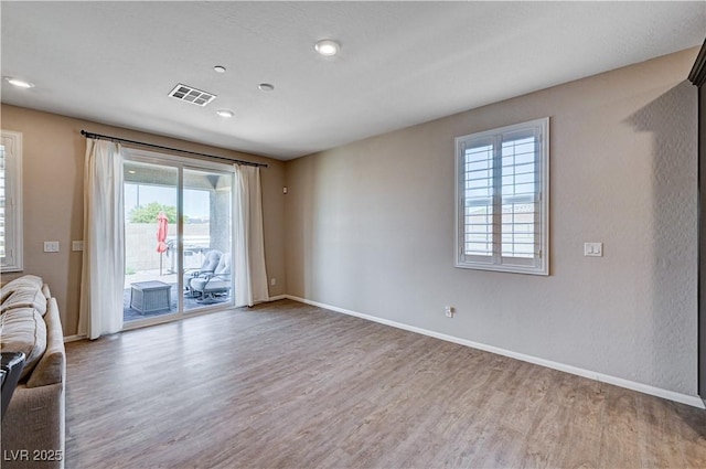 2902 Ventana Ridge Ave, Henderson, NV 89044 - unfurnished living room with wood finished floors, plenty of natural light, baseboards, and recessed lighting