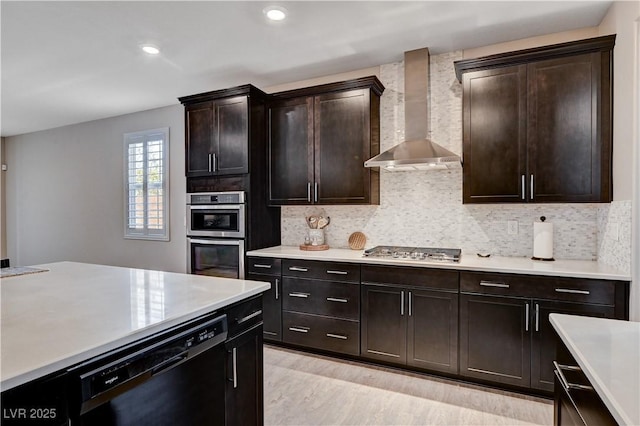 2902 Ventana Ridge Ave, Henderson, NV 89044 - kitchen with wall chimney range hood, appliances with stainless steel finishes, light countertops, and recessed lighting