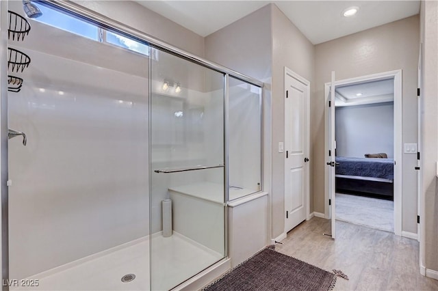 2902 Ventana Ridge Ave, Henderson, NV 89044 - full bathroom featuring wood finished floors, a stall shower, connected bathroom, and baseboards