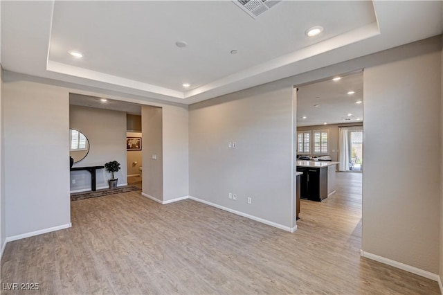 2902 Ventana Ridge Ave, Henderson, NV 89044 - unfurnished room featuring a raised ceiling, light wood finished floors, recessed lighting, and baseboards