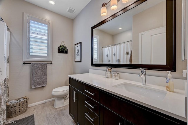 2902 Ventana Ridge Ave, Henderson, NV 89044 - bathroom with plenty of natural light, vanity, baseboards, toilet, and recessed lighting
