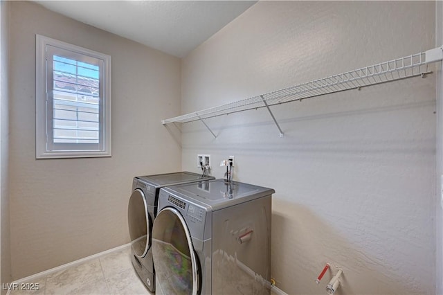 2902 Ventana Ridge Ave, Henderson, NV 89044 - washroom featuring separate washer and dryer, baseboards, and light tile patterned floors
