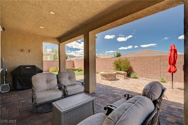 2902 Ventana Ridge Ave, Henderson, NV 89044 - view of patio featuring area for grilling, a fire pit, and a fenced backyard