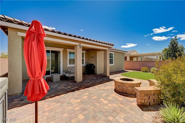 2902 Ventana Ridge Ave, Henderson, NV 89044 - view of patio featuring fence and an outdoor fire pit