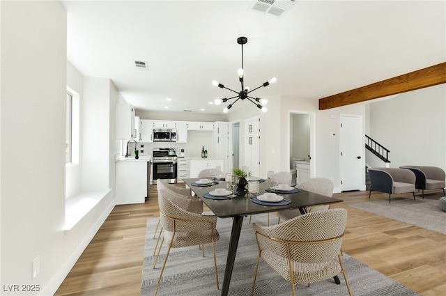 1724 Navajo Lake Way, Las Vegas, NV 89128 - dining area featuring a chandelier, light wood-type flooring, stairway, recessed lighting, and beam ceiling