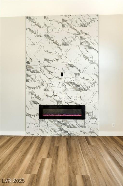 1724 Navajo Lake Way, Las Vegas, NV 89128 - detailed view of a fireplace, wood finished floors, and baseboards