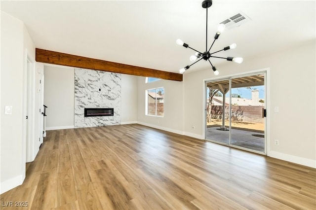 1724 Navajo Lake Way, Las Vegas, NV 89128 - unfurnished living room with a chandelier, light wood finished floors, a fireplace, baseboards, and beam ceiling