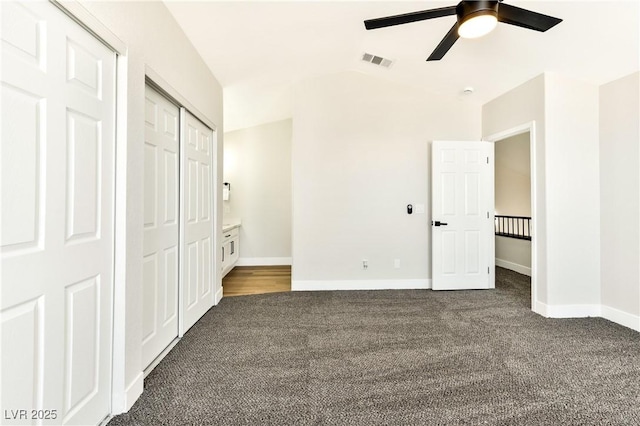 1724 Navajo Lake Way, Las Vegas, NV 89128 - unfurnished bedroom featuring dark colored carpet, lofted ceiling, baseboards, ceiling fan, and a closet