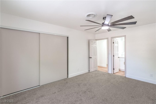5239 Elgin Cir, Las Vegas, NV 89122 - unfurnished bedroom with a closet, carpet flooring, baseboards, ensuite bath, and a ceiling fan