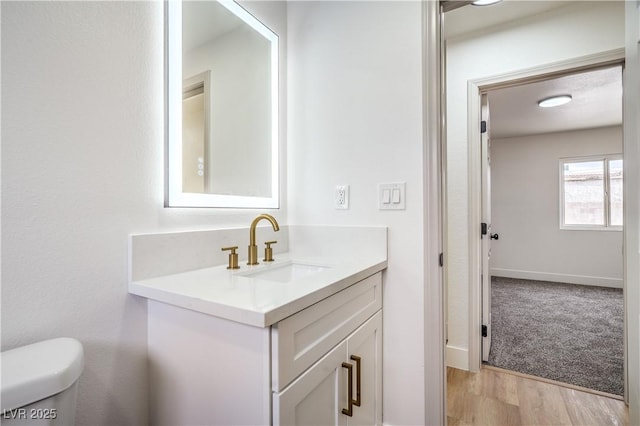 5239 Elgin Cir, Las Vegas, NV 89122 - half bath with vanity, toilet, and wood finished floors