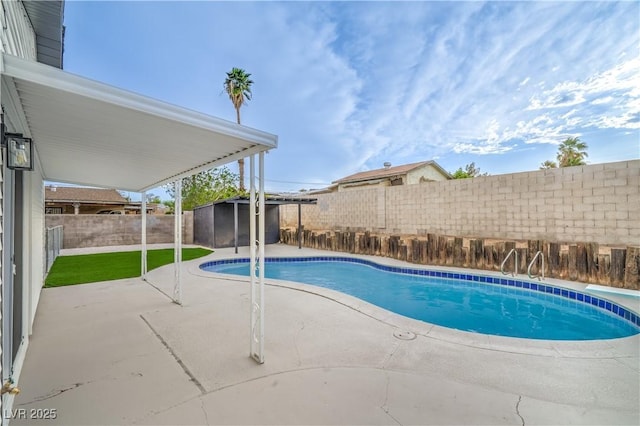 5239 Elgin Cir, Las Vegas, NV 89122 - view of swimming pool with a patio, a fenced backyard, a storage unit, and an outdoor structure