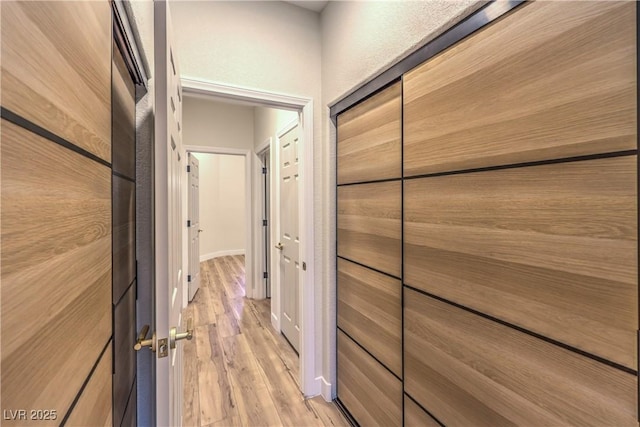 5010 Crooked Stick Way, Las Vegas, NV 89113 - corridor with light wood-style flooring