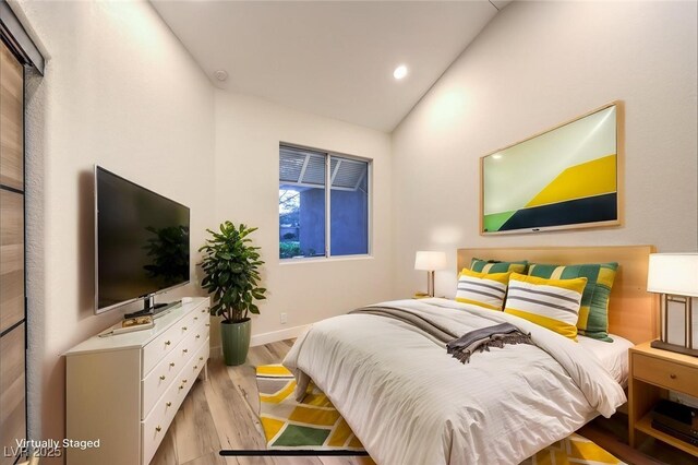 5010 Crooked Stick Way, Las Vegas, NV 89113 - bedroom featuring lofted ceiling, light wood-style flooring, baseboards, and recessed lighting