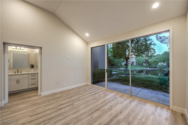 5010 Crooked Stick Way, Las Vegas, NV 89113 - empty room featuring a sink, light wood-style floors, baseboards, recessed lighting, and high vaulted ceiling