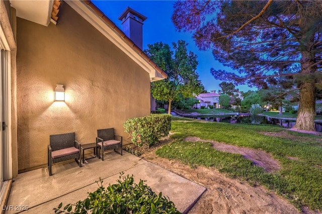 5010 Crooked Stick Way, Las Vegas, NV 89113 - view of green lawn featuring a patio and a water view