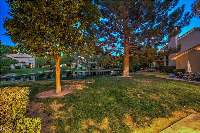 5010 Crooked Stick Way, Las Vegas, NV 89113 - view of grassy yard featuring a water view