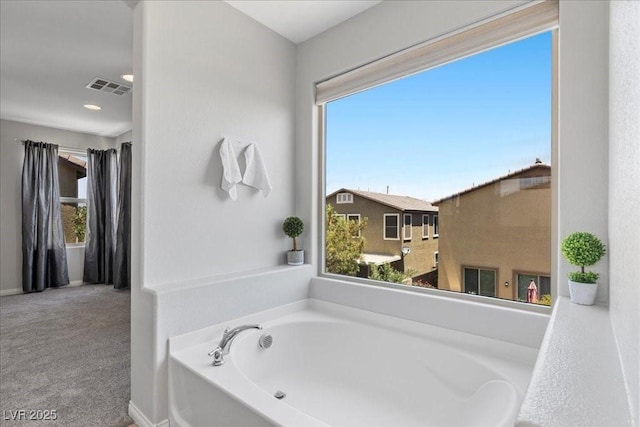2276 Sky Island Dr, Henderson, NV 89002 - bathroom with a garden tub and plenty of natural light