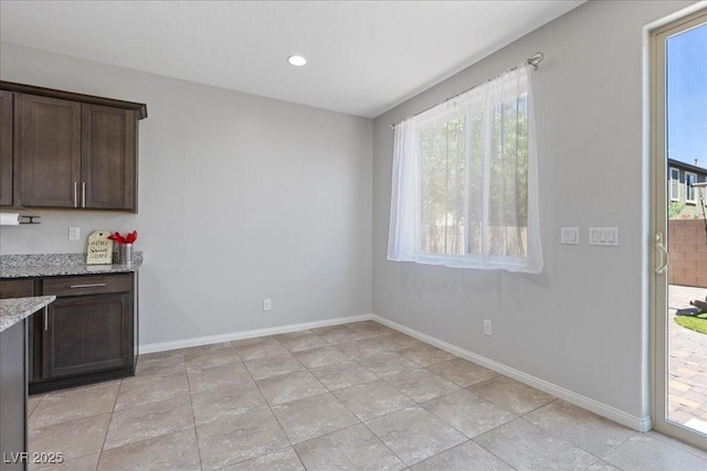 2276 Sky Island Dr, Henderson, NV 89002 - unfurnished dining area featuring baseboards and recessed lighting