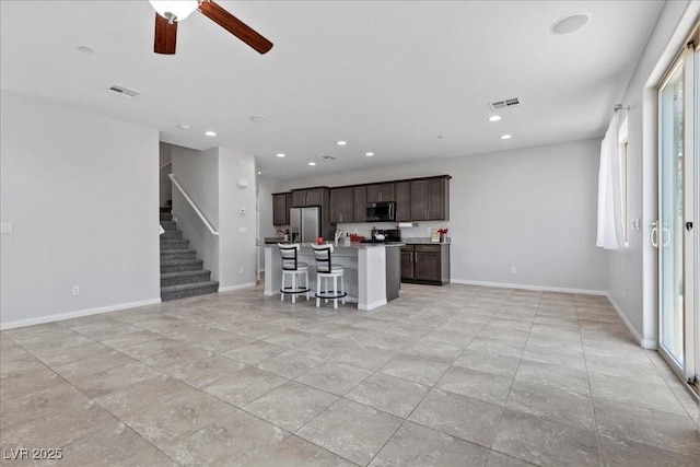 2276 Sky Island Dr, Henderson, NV 89002 - living area featuring ceiling fan, recessed lighting, and stairs