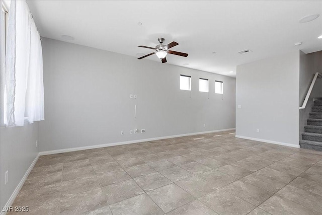 2276 Sky Island Dr, Henderson, NV 89002 - empty room featuring stairs, ceiling fan, and a smoke detector
