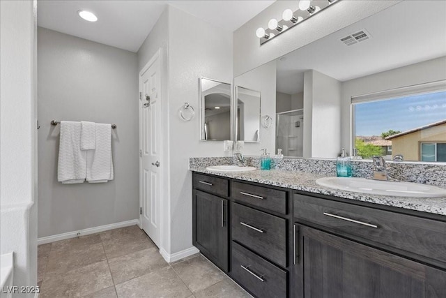 2276 Sky Island Dr, Henderson, NV 89002 - full bathroom featuring double vanity, a stall shower, and tile patterned flooring