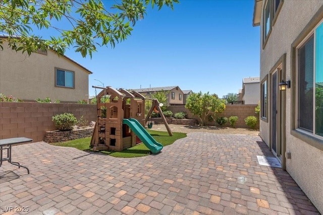 2276 Sky Island Dr, Henderson, NV 89002 - view of play area featuring a fenced backyard and a patio area
