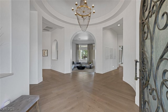 8130 Cassian Ct, Las Vegas, NV 89129 - foyer featuring arched walkways, a chandelier, and baseboards