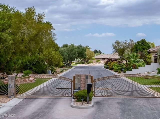 8130 Cassian Ct, Las Vegas, NV 89129 - view of asphalt street with a gate