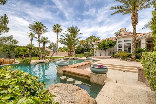 8130 Cassian Ct, Las Vegas, NV 89129 - view of home's community with a swimming pool, a hot tub, and a patio
