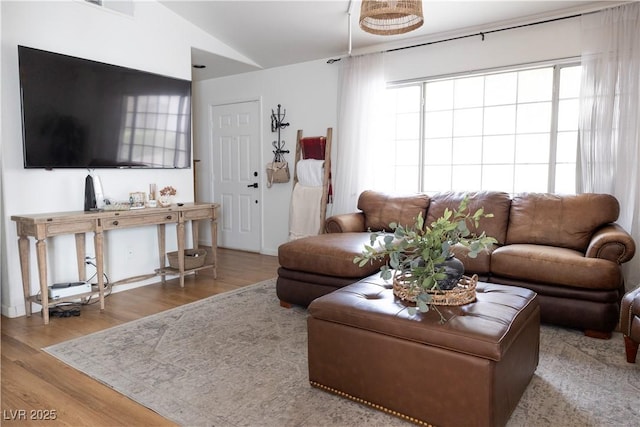 5400 Tassara Way Unit 106, Las Vegas, NV 89108 - living area featuring wood finished floors and vaulted ceiling