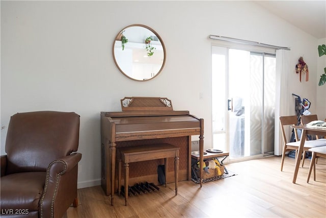5400 Tassara Way Unit 106, Las Vegas, NV 89108 - sitting room featuring wood finished floors and lofted ceiling