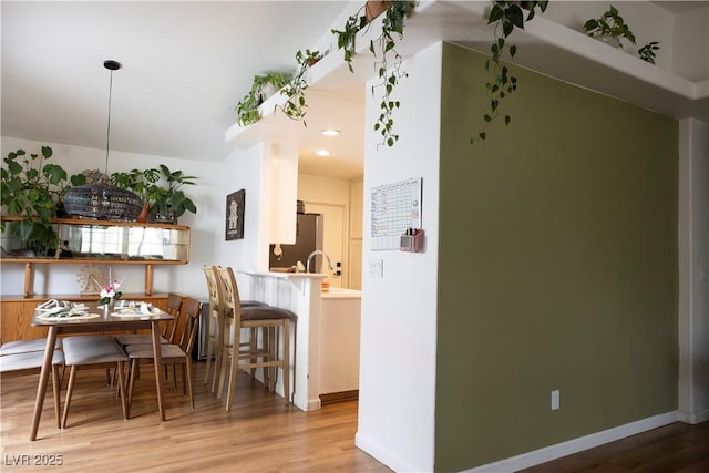 5400 Tassara Way Unit 106, Las Vegas, NV 89108 - dining area with wood finished floors, baseboards, and recessed lighting